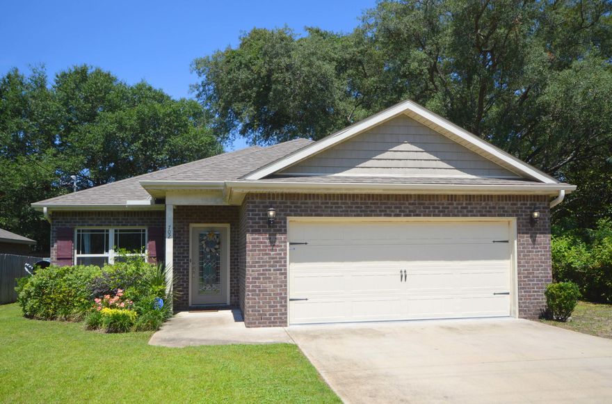 2011 MODERN CONSTRUCTION 4 BED, 2 BATH- NO NEED FOR UPDATES HERE.The modern construction of this brick offers peace of mind and amenities not featured in the area's older residences.Walking up your spacious driveway, past your two-car garage, enter the home and notice the porcelain-tiled floors which lead throughout the home. Archways to the dining room and kitchen lend grandeur to the living area's open floor plan. The kitchen, complete with GE appliances, Samsung refrigerator, and soft-close cabinets, features granite countertops and a breakfast bar that overlooks the living room. The split bedroom floorplan has three bedrooms and a bath on one side of the home, and the master bedroom on the other.