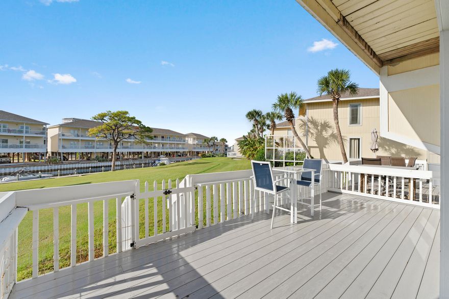 Exquisitely decorated unit on the golf course/canal with a view of the Sunset of the Destin Harbor.  Step into paradise with this stunning, fully renovated 1-bedroom, 1-bath canal-front unit offering 654 sqft of luxurious living space. No detail has been overlooked in this unit featuring fresh paint, crown molding, upgraded ceilings, and stainless-steel appliances. The spa-like bathroom includes a walk-in glass shower, while the unit also boasts a full washer/dryer and ample storage throughout.Enjoy the peaceful canal views and harbor from the extended back deck, crafted with Wear Deck--fiberglass composite decking that stays cool to the touch. Whether it's breathtaking sunrises or sunsets, this private retreat offers a front-row seat to nature's beauty.