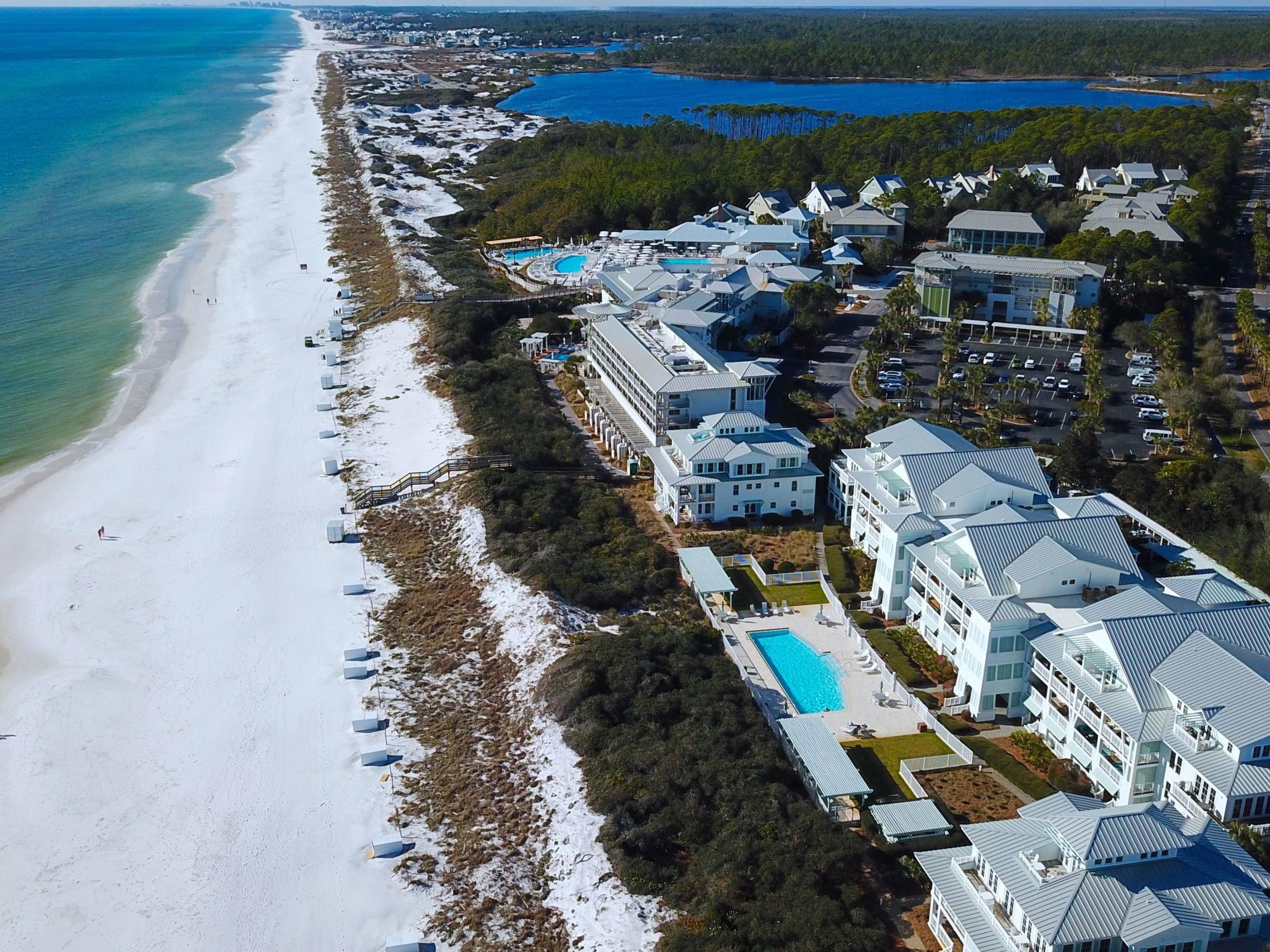 Presenting this rare opportunity to own a spacious three-bedroom gulf-front condo in the community of WaterColor. Located on Scenic Highway 30A, this two-story unit features beautiful wood flooring in the main living areas, high ceilings, and a chef's kitchen with stainless steel appliances and granite countertops. Enjoy gulf views from the upper balcony, easily accessed by both the gulf-front living room and master bedroom on the second level. Porch access from the first floor leads directly to an expansive pool reserved for owners and their guests. Additional amenities include dedicated parking and a storage area - both of which can be found in the first-floor garage.