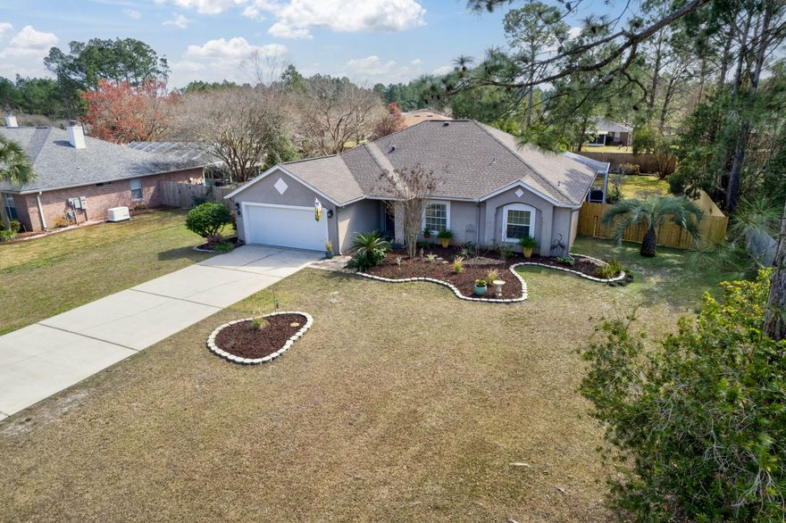 Welcome to Brewster St. Impeccably assembled with concrete block and steel, this classic single-family residence is a pristine design featuring 1966 Sq Ft of living space. The home greets you with an open floor plan wonderfully covered with new flooring. The entire area is filled with soft, natural light, brightening the atmosphere and blossoming a cozy and peaceful niche within. Vaulted ceilings expand on its open quality, promoting a sense of space and freedom. The house offers three well-planned bedrooms providing the perfect ambiance for relaxation and privacy, and the charm doesn't stop there. The master suite features an extremely aesthetic trey ceiling, coupled with a large tastefully tiled master bath boasting a spacious walk-in shower, offering