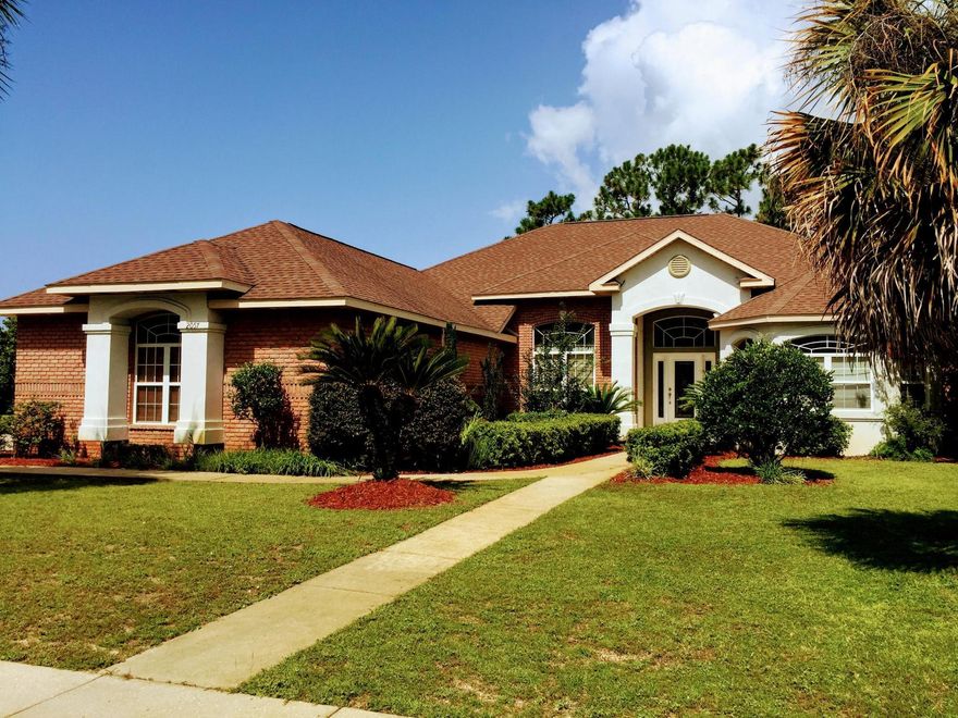 Come see this beautiful custom-built home in one of Navarre's most prestigious gated neighborhoods! This home features soaring ceilings throughout. Four bedrooms and three full bathrooms make great use of over 2900 sqft of living space. The kitchen is complete with granite countertops, an island with a cooktop, plenty of cabinets for storage, stainless steel appliances, and more. The almost 400 sqft master bedroom gives you plenty of room to spread out and relax. The master bath has a walk-in tiled shower with dual heads, an oversized tub for soaking in, double vanity, and plenty of light. The additional bedrooms are not afterthoughts in this home, with plenty of functional space for family and friends. And that's only some