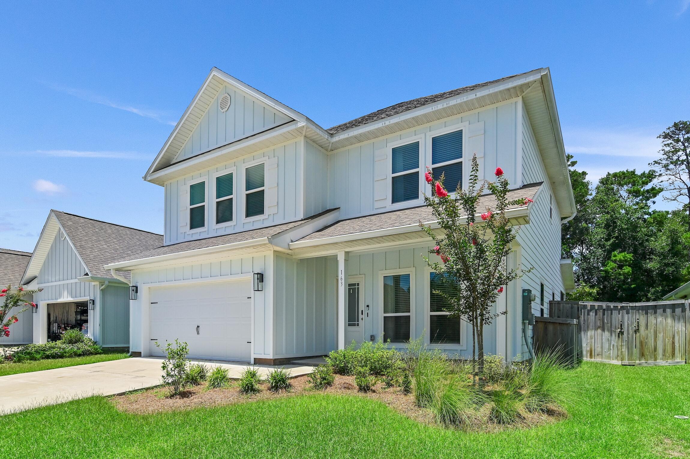 Welcome to this stunning home in Santa Rosa Beach, offering 2457 ft. of extensive living space. Constructed in 2021, this four-bedroom, four-bathroom home is perfect for families or those looking for extra space. As you enter, you will be greeted by EVP flooring throughout the entire home, stainless steel appliances, granite countertops, and a designer lighting package. The open, inviting dining and living spaces are perfect for entertaining. Natural light floods the home, creating a warm and welcoming atmosphere.The master bathroom boasts a large walk in shower with a seat as well as a walk in closet. A whole house water softening system by Aqua Pro has been installed for added convenience. As you walk upstairs, there is a bonus living area that is open and inviting. Outside, there is a sizeable screened in porch, that includes a wall mounted television and an expansive backyard that provides plenty of space for children and family pets to play. Complete with a fire pit, it is the perfect spot for outdoor gatherings. Just minutes away from the stunning beaches of 30a and the shops of Seaside, this home offers the perfect blend of luxury and convenience. Don't miss out on the opportunity to make this house your new home.