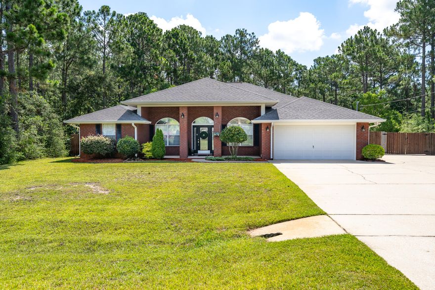 This stunning home located at 2112 Seagrape Drive in Navarre, FL, where luxury living meets coastal charm.  With 4 bedrooms and 2 bathrooms spread across just under 2200 square feet living space, this is ideal for families looking for a spacious and luxurious retreat.
As you step inside, you are greeted by a bright and airy open concept floor plan with high ceilings and ample natural light. The gourmet kitchen features ample granite countertops, stainless steel appliances and plenty of storage, making it a chef's dream.
Another standout feature of this home is the expansive backyard, complete with a sparkling pool and a covered patio area, ideal for outdoor entertaining and enjoying the beautiful Florida weather
Schedule your showing now. This stunning home located at 2112 Seagrape Drive in Navarre, FL, where luxury living meets coastal charm.  This home offers the perfect blend of comfort, style, and convenience. With 4 bedrooms and 2 bathrooms spread across just under 2200 square feet living space, this is ideal for families looking for a spacious and luxurious retreat.

As you step inside, you are greeted by a bright and airy open concept floor plan with high ceilings and ample natural light. The gourmet kitchen features ample granite countertops, stainless steel appliances and plenty of storage, making it a chef's dream.

For those who love to entertain, this living room has ample space for hosting dinner parties or game nights. The layout is perfect for mingling with guests while still feeling connected to the rest of the home. Whether you're looking to relax after a long day or gather with loved ones, this living room is the perfect backdrop for any occasion

Another standout feature of this home is the expansive backyard, complete with a sparkling pool and a covered patio area, ideal for outdoor entertaining and enjoying the beautiful Florida weather. Imagine hosting summer barbecues or lounging by the pool with a refreshing drink in hand.

The master suite is a haven of relaxation, with a spacious bedroom, walk-in his and hers closets, and a luxurious en-suite bathroom featuring dual vanities, a soaking tub, and a separate shower. The three additional bedrooms are generously sized and perfect for guests or family members.

Located in Holley by the Sea, this home is in a top-rated school district, making it a great choice for families with school-age children. Nearby shopping centers, restaurants, and amenities provide convenience and entertainment options for residents.

Whether you are looking to relax on the sugar white sand beach, explore the nearby nature trails, or indulge in some delicious seafood, this home offers the perfect blend of luxury and accessibility. Everything is just a short drive away.

Schedule your showing now.