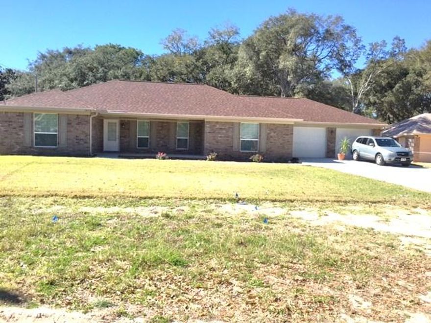 Less than 2 year old Home! Great home in a very convenient location. This 3/2 features stainless appliances, granite counter tops, tiled floors in main living areas and spacious bedrooms. Comes complete with washer & dryer (non-warranted). You'll love all the storage available inside as well as in the spacious garage. Fenced back yard ideal for kids & pets to play. Owner will consider a dog (no Cats). Any dog must be spayed/neutered & housebroken. A non-refundable pet fee and a refundable pet deposit are required. NO SMOKING! Tenants must agree to pay $6.95 monthly for whole house surge protection. Any person 18 years old or older must complete separate applications and pay separate application fees.