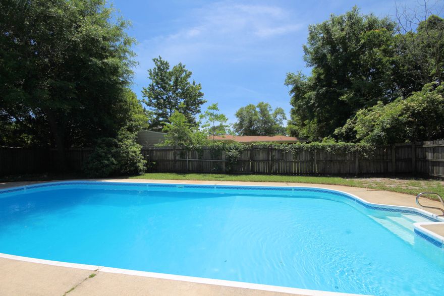 Updated POOL home for sale in the heart of Ft Walton Beach. This 4 bedroom home has a large pool, great room w/ formal living area/formal dining area, separate family room, double sided fireplace and downstairs master bedroom! Step inside and you will notice the REAL hardwood floors, tile floors, soaring ceilings and great floor plan. You will appreciate the updated kitchen, stainless appliances, updated bathrooms and the Florida Room! There's plenty of storage in this house and an interior laundry room, security system. All new doors installed and exterior has just been painted. Newer pool pump, roof 2009. FREE one year home warranty. Close to schools, Eglin AFB, Hurlburt Field and beaches. NO aluminum wiring!!! Make your appointment to view this home today before it's too late.