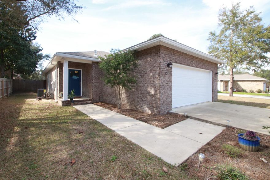 Beautifully finished home in a quiet neighborhood - open floor plan, 9' ceilings, attractive engineered hardwood floors, ample granite counter space/breakfast bar in kitchen, recessed lighting & custom cabinets, under mount sink, all stainless Whirlpool appliances including gas convection oven, nice pantry, open kitchen/dining/living area, matching granite counter tops & tile in bathrooms, custom shower/double sink/walk-in closet in master suite, cabinets & floor drain in laundry room, substantial attic storage, gas water heater, spacious 2-car garage, covered back patio, large fenced in backyard, sprinkler system. Top-of-the-line amenities all the way around. - Niceville School District - Close access to 85, 285, and 293 (the new Mid-Bay Bridge Connector) to get to Destin, Crestview, or  I-10 easily. (Eglin is less than 9 miles away, Hurlburt is 17 miles away, 7th Group and Duke Field is 11 miles away)
This is one of the few newer brick homes in Niceville at this price with a large fenced in yard, NO HOA, centrally located with many upgrades including blinds and Fridge! 