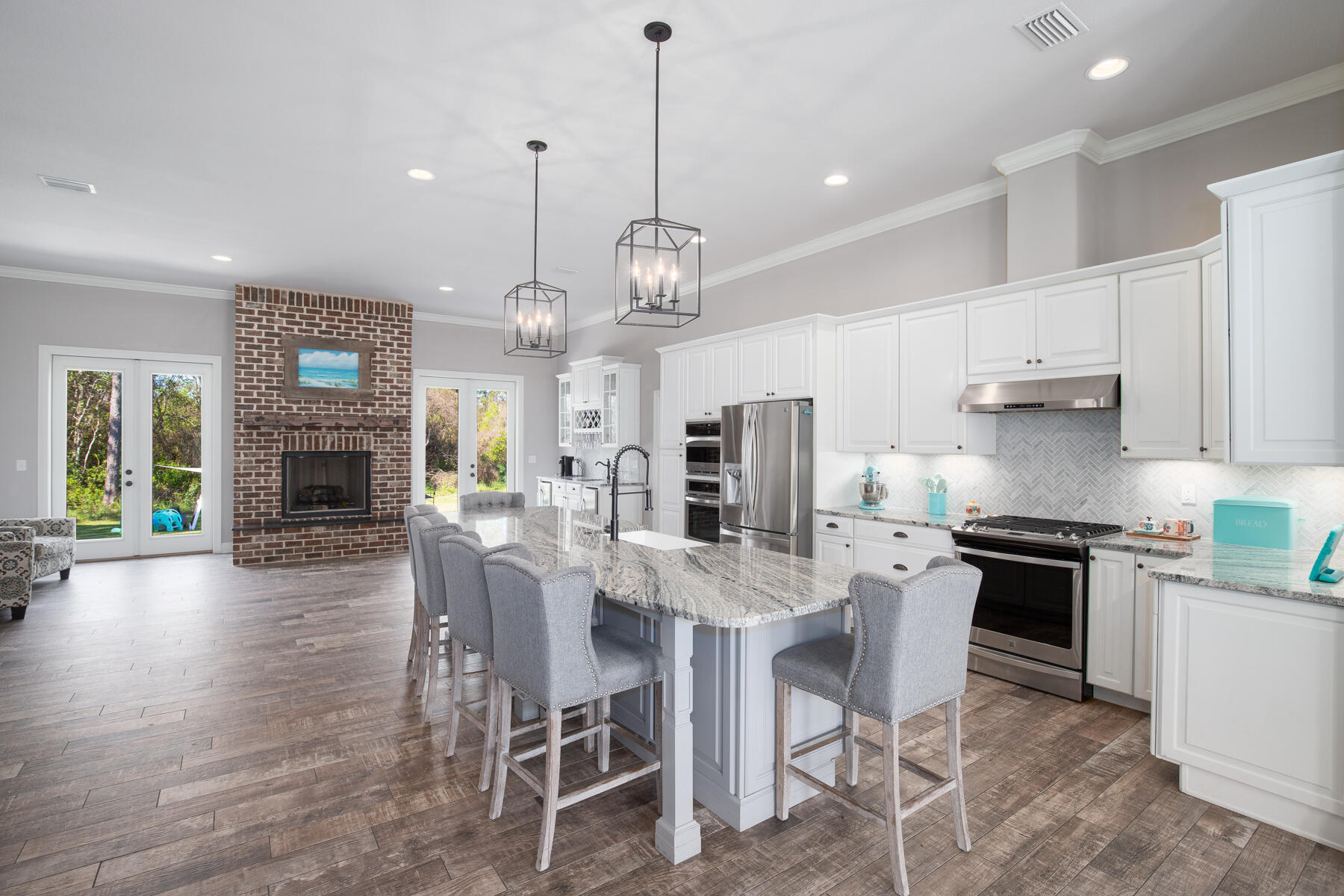 This stunning custom-built home is not only luxurious, but it is also eco-friendly and energy-efficient. The well-planned property features solar panels that have already produced 58.6 MWh since 2019, reducing energy costs and minimizing the home's carbon footprint. Coupled with spray foam roof deck, Rockwool insulation interior walls, and a built-in dehumidifier and energy-efficient air conditioner, this home is incredibly energy-efficient and comfortable year-round. This an excellent opportunity to own a home that is doing its part to be eco-friendly as well as luxurious.From the moment you step inside, you'll be captivated by the high-end finishes and attention to detail.