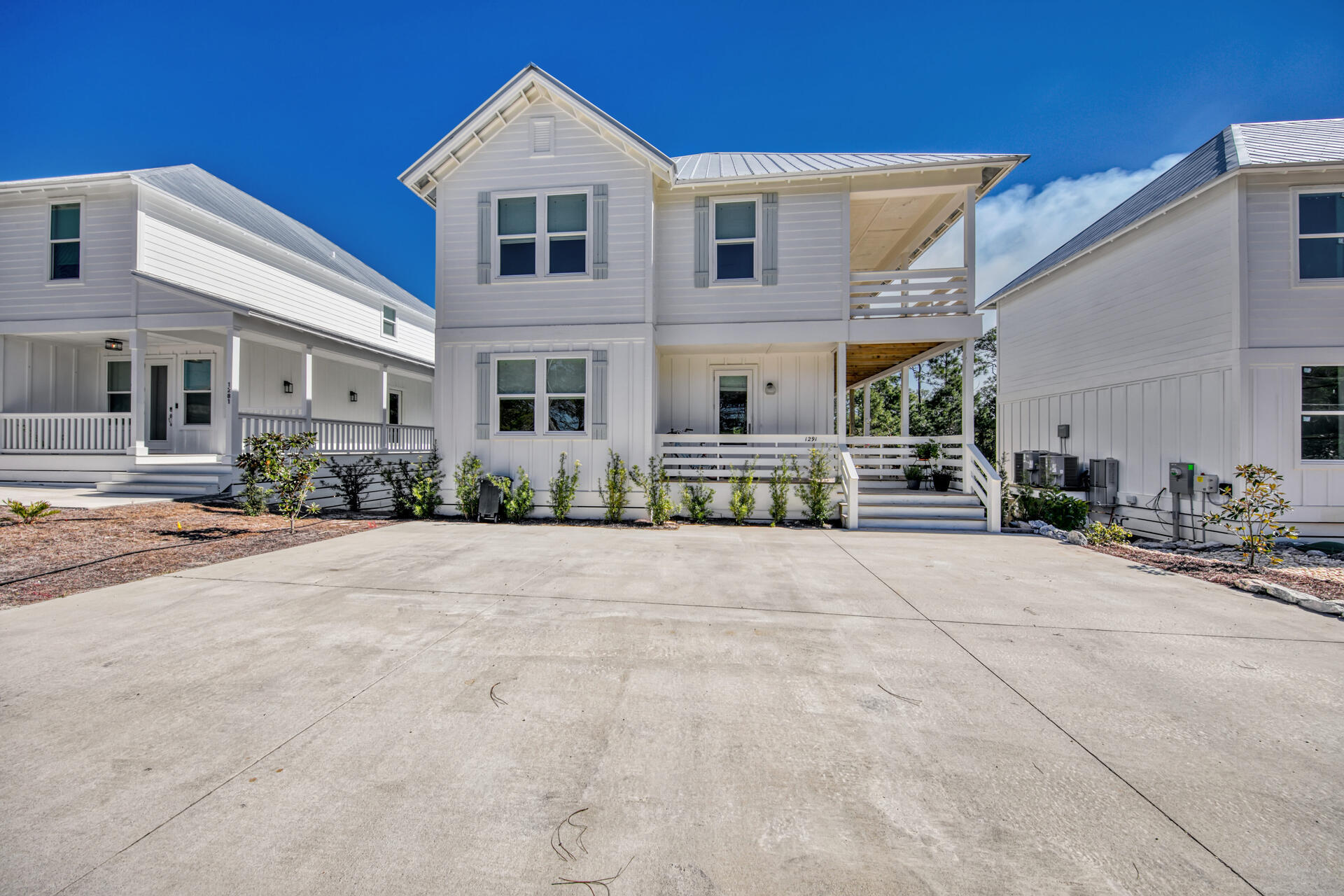 Located within walking distance of Ed Walline beach access and Gulf Place, this new construction 4 bedroom, 3 1/2 bath house is perfect for a second home or rental property.  No HOA!  There is a private pool in back with a covered patio for grilling and yard backs up to preserve.