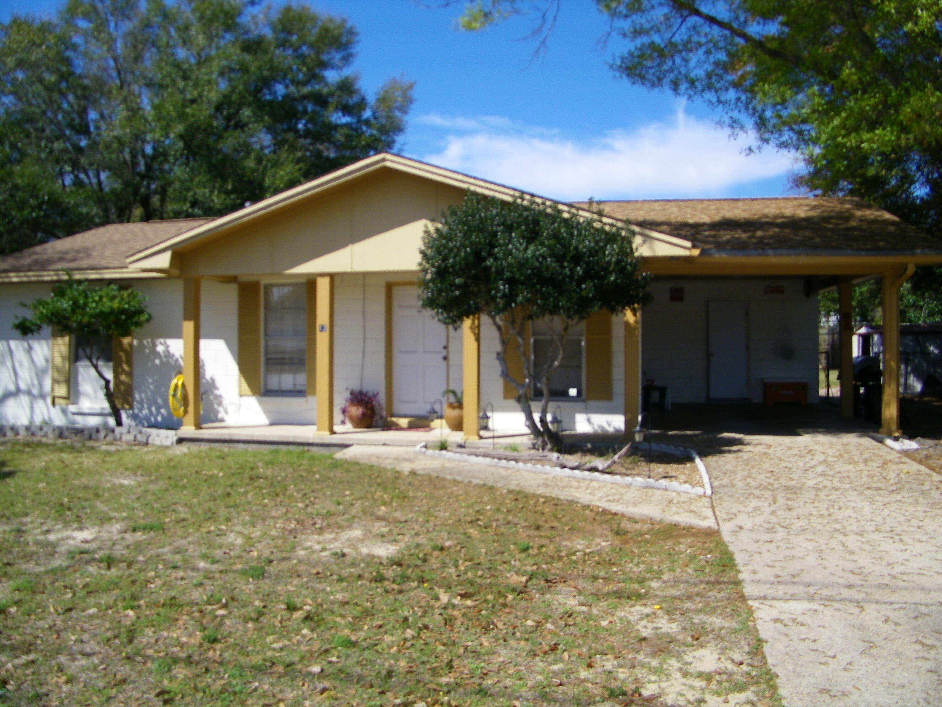 Welcome to this 3 bedroom, 1.5 bathroom home, featuring a covered carport and a welcoming front porch. Located in a convenient area close to shopping, restaurants, and local amenities, this home offers both comfort and accessibility. Inside, you'll find a practical floor plan with ample natural light and a spacious main living area. The kitchen offers plenty of cabinet space and flows easily into the dining and living areas, making it great for daily living or entertaining. The large, fenced-in yard is perfect for outdoor enjoyment and dogs are welcome! The owner allows dogs of any size, fully grown, with an approved pet application and deposit. All Coastal Realty Services residents are enrolled in the Resident Benefits Package (RBP) which includes renters insurance.