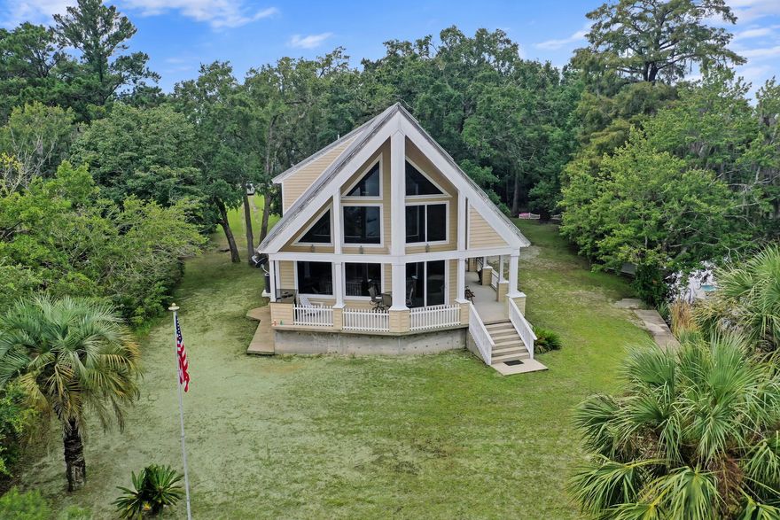 Under contract with a 72 hour kick out clause..bring offers!Wonderful Bayou living on 1.62 acres without the hustle and bustle. This one owner A-frame home has three bedrooms and two baths. Complete with tile floors, carpeted bedrooms, granite counter tops and a loft with a wet bar. The oversized primary suite overlooks the beautiful landscape. Stunning sunrise view over the bayou from the spacious wrap around porch. Just 10 miles from Niceville and the Destin bridge, this location is hard to beat.