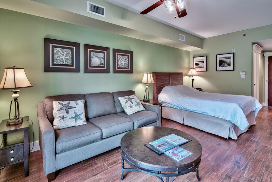 This beautiful 1st floor studio condominium in Lasata offers a large open patio overlooking the Grand Lawn. The open living/dining area is finished with porcelain wood tile for easy maintenance. There is a queen size sleeper sofa to accommodate extra guests in addition to the Queen size bed. The morning kitchen is complete with microwave, toaster, coffee maker, and refrigerator. Lasata owners enjoy the use of the large resort style lagoon pool, fitness center, and the private Solstice Club. All of this located in The Village of Baytowne Wharf, just a short walk from the retail shops, restaurants, and all the activities, as well as the white sugar sand beaches, a 98 slip marina, 4 championship golf courses, and a world class tennis facility with 15 courts.