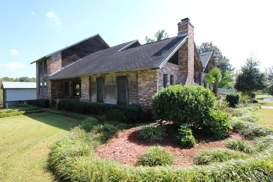 Perfect Gentleman's Farm on 40 acre tract. The property is fenced and cross-fenced with a creek on the property. The view of the property from the back porch is amazing.The home was built in 1985. It includes 3 bedrooms and 2 -1/2 bathrooms with 3,150 square feet of heated/cooled living area. The living room is sunken with carpet and has a 21' ceiling. The dining room is glassed on one side and has marble flooring with columns which separate the living room and dining room. The dining room ceiling is 9'.The den has a curved, brick, raised hearth fireplace and carpeting. The ceiling height in the den is 12'.The kitchen has solid cherry wood cabinets, Mexican tile flooring, and a brick arch with the oven built-in and a desk area. This ceiling is 9'. The breakfast room