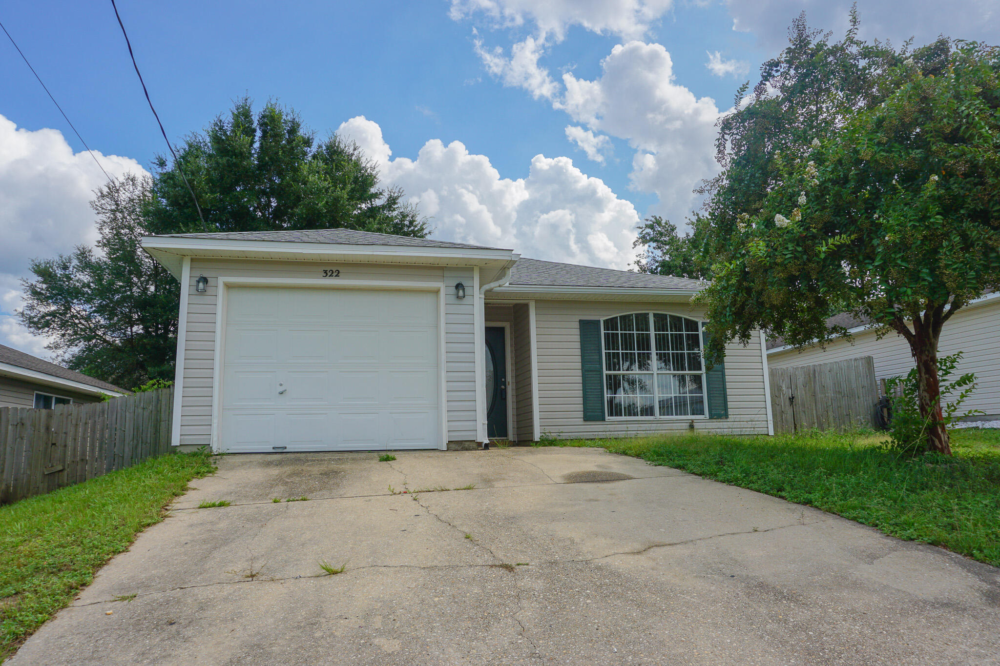 Avail. NOW!!. This Inviting open floor plan home is ready for you to call home! 3bed/2bath quaint home off PJ Adams, South Crestview! Home features stainless steel appliances, LVP flooring, single-car garage, walk-in master closet, and fenced backyard, W/D hookups. Large living space and kitchen island for your gatherings! No inside smoking or vaping. Pets allowed with $400 non-refundable pet fee with owner approval. Apply with La Bella Vita today!