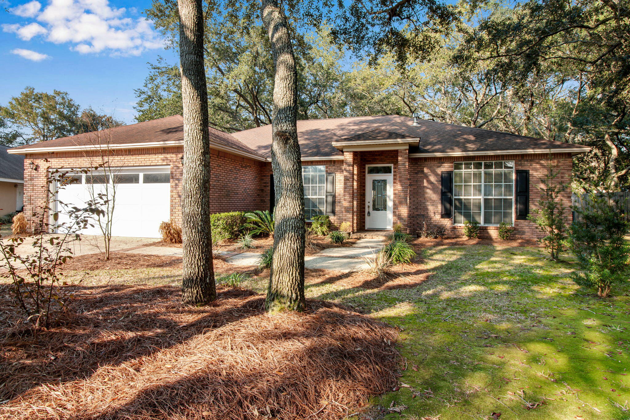 Welcome to prestigious Southwind!A gated community In BWB.Don't miss this great opportunity to live in Southwind an exclusive neighborhood!This lovely brick home is located on a quiet cul-de-sac and has built in equity and appreciation as it is the lowest price house in Southwind! Your family will love this freshly painted home. Enjoy the large formal Dining room, the open kitchen with lots of cabinets and an island for entertaining while overlooking the massive backyard.You will love gathering in the Family room with cathedral ceilings and beautiful plank tile flooring while enjoying the Gas log fireplace making this room warm and cozy. Open the French doors to the large tiled Florida Sunroom that is a huge bonus! Enjoy the open split floorplan in this stunning Bluewater Bay home