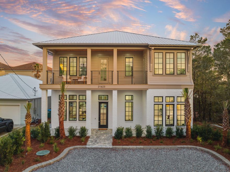 Welcome to 21623 Dolphin Avenue, a brand-new coastal masterpiece perfectly positioned on the coveted west end of Panama City Beach. This stunning new construction residence offers an unparalleled blend of luxury, craftsmanship, and prime location--just a five-minute stroll (0.25 miles) to pristine white-sand beaches and steps from convenient beach access. Spanning 3,363 square feet of thoughtfully designed living space, this five-bedroom, five-bathroom home is crafted to deliver both sophistication and comfort. Soaring 12-foot ceilings on the main level and 10-foot ceilings upstairs create an expansive, airy ambiance, while large impact-rated windows and doors flood the interiors with natural light and ensure long-term durability. Engineered for efficiency and resilience, the home features 2x6 construction, R-19 insulation, and a spray-foamed roof deck, offering superior energy savings and year-round comfort.

Luxury is in every detail, from the 8-foot solid wood interior doors to the premium luxury vinyl plank flooring, solid maple staircase, and exquisite Carrera marble tile. The chef's kitchen is designed for both entertaining and function, boasting natural stone countertops and high-end appliances, including a 36" natural gas range, a 48" refrigerator, dual dishwashers, a drawer microwave, and a powerful 700 CFM hood. Custom-built wooden shelving in each closet adds an extra touch of sophistication.

The outdoor oasis is an entertainer's dream, featuring a fully-equipped summer kitchen with a built-in natural gas grill, an ice maker, and a sinkperfect for al fresco dining. A heated saltwater pool, an outdoor shower, and lush, maintenance-free landscaping with a privacy fence create an exclusive retreat for relaxation and entertainment.

Nestled in one of Panama City Beach's most sought-after locations, this exquisite home offers effortless access to the area's best beaches, premier shopping, and world-class dining. Pier Park, known for its vibrant mix of boutiques, restaurants, and entertainment, is just minutes away, while the charm and sophistication of Rosemary Beach and Scenic 30A are within easy reach. With no HOA restrictions, this exceptional property allows for true ownership freedom in one of the Gulf Coast's most coveted enclaves.

In addition to its luxurious features and prime location, this property boasts a projected rental income of $150,000 to $160,000, making it an outstanding investment opportunity.

Don't miss this rare opportunity to own a brand-new coastal sanctuary steps from the Gulf. Contact us today to learn more and secure your place in paradise!