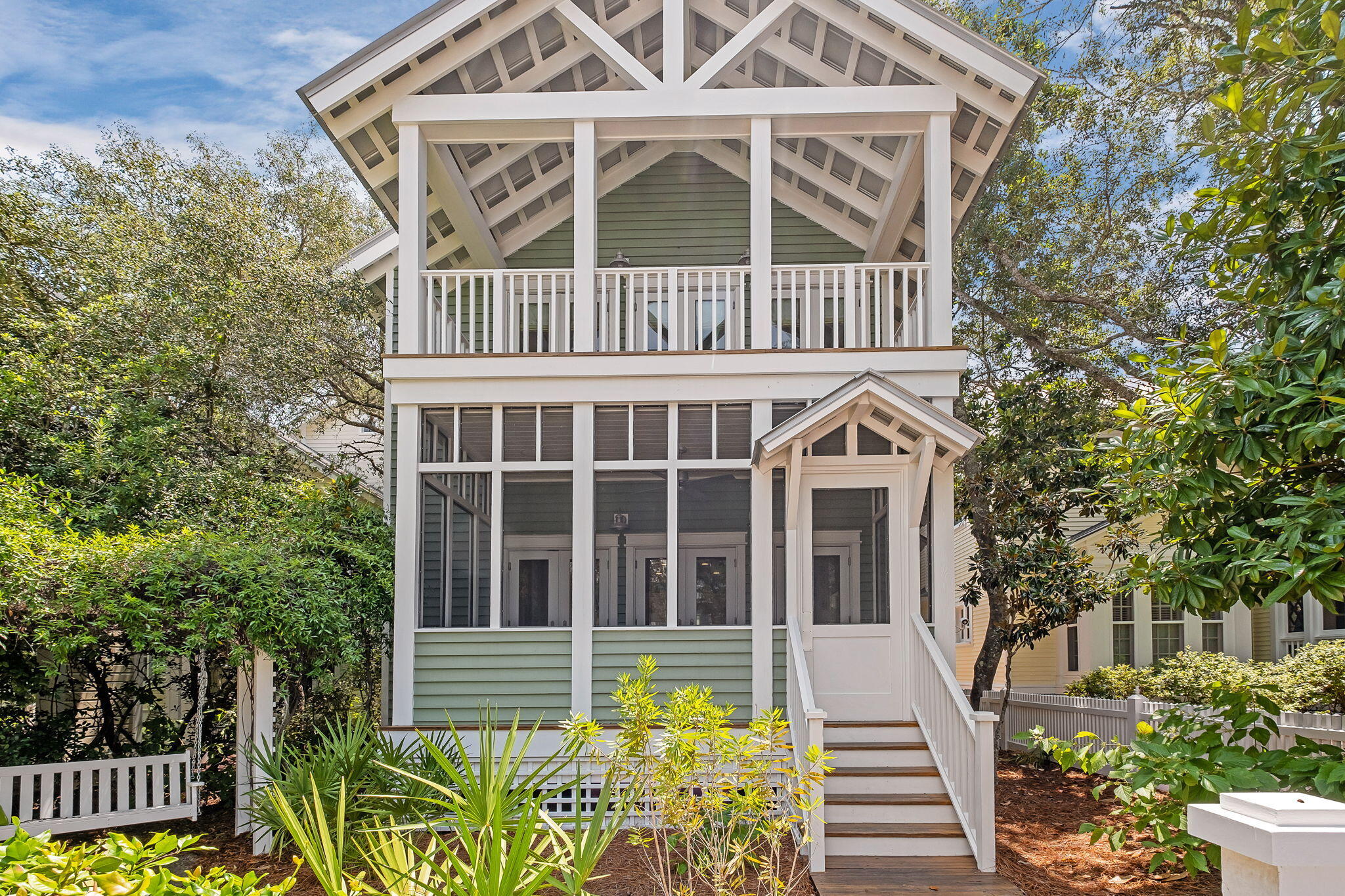 Location location location!! Irish Cottage is located only a 3 minute walk to the beach, is a quick stroll to downtown Seaside, and overlooks the iconic Tupelo Gazebo. You wont need a golf cart or bikes with a home this close to the beach! This two-story home comfortably sleeps 12 with 2 primary en suite bedrooms, one on each floor! Yes, all 2,674 sq ft is in one large home, allowing the family to stay together instead of split b/w a small house and guest cottage.Scaling Charm into a Spacious Family Retreat:The timeless design created in 2013 by the award winning Tom Christ & Associates reimagined the 5th cottage built in Seaside into a spacious family home retaining its original drive-up charm along with its iconic arbored swing featured in several Seaside coffee table books Be sure to click on the 3D Virtual Tour for an interactive experience of walking through the home at your own pace and seeing exactly how the home flows. Below is a quick reference break down of each floor for your convenience.
First Floor:
- Private Primary Suite on first floor with king bed.
- Office, currently being used as secondary bedroom with Double Bed, single trundle bed underneath, and full bath in adjacent hallway
Second Floor:
- Extra spacious second Primary Suite with king bed and sitting area with private porch.
- Spacious Sleeping Den with 3 queen beds and a sitting area with half bath attached and full bath in adjacent hallway
What the owners LOVE about this home:
- Within 240 feet of the Tupelo Beach Pavillion
- 2 primary suites with king beds, one on each floor.
- Spacious bedrooms are separated throughout the house to allow for quiet rest from the fun and sun.
- Open floor plan with 9 -10 foot ceilings
- 1st level screened front porch that looks upon Tupelo gazebo
- Private front balcony off 2nd floor primary suite
- Additional private side porch for evening gatherings
- Major Renovation in 2013
- Large walk-in pantry
- Private home, not on the rental market.
- Huge exterior storage closet in rear of home
- Iconic arbored swing featured in Seaside books