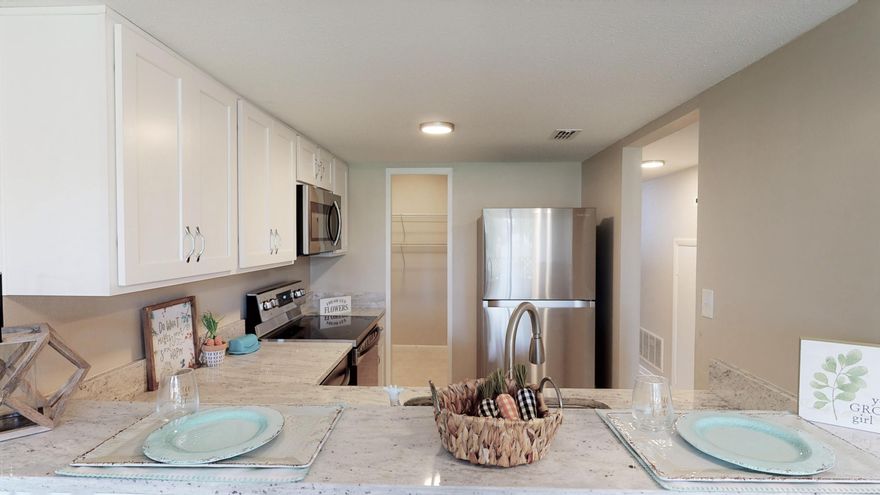 Remodeled from top to bottom! New Roof, New HVAC, New Stainless Steel Appliances, New Granite Countertops, New Cabinets, New Fixtures, New vanities, New Carpet.. did I say NEW?2 Bedrooms (both on second floor), 1.5 bath, small eat in kitchen with extra seating at the kitchen bar, large pantry, rear covered patio, with W/D hook ups (in the laundry room, outside off of the patio), and a short distance to the community pool!