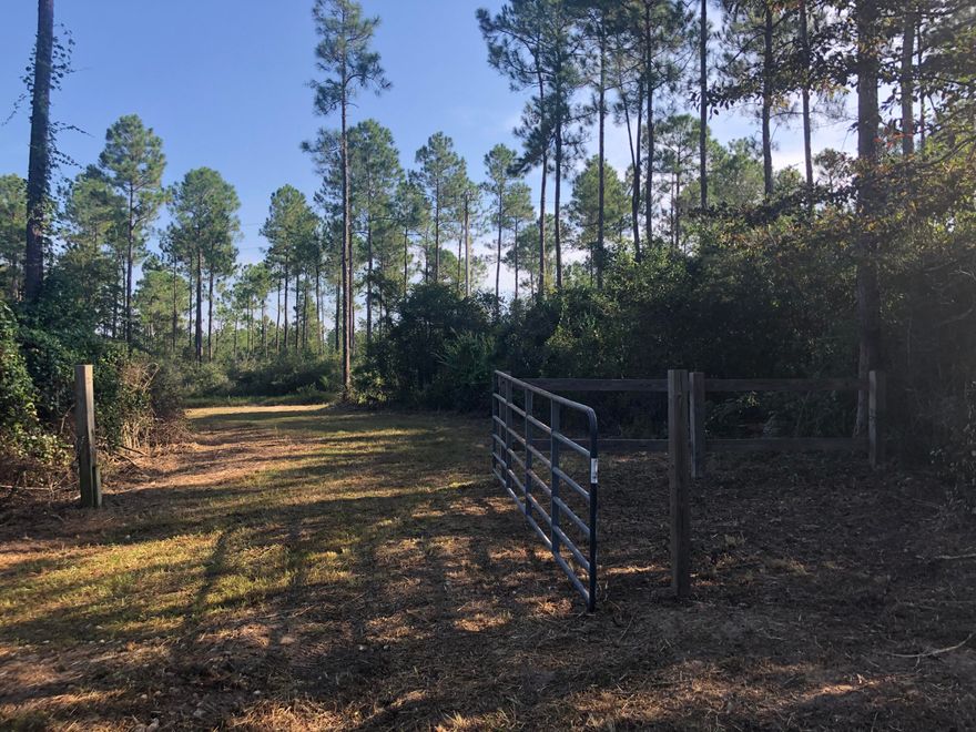 Great opportunity to own a turn key hunting homestead in an Amazing Gated Sportsmen Community!! Manufactured in 2014 and very well cared for, this 3 bedroom and 2 bath home sits on nearly 27 acres of privacy in nature. Home features include split bedroom design, large master and ample master bath with garden tub and separate shower. Roomy and open kitchen with plenty of storage and counter-space and stainless appliances. But this place is for the outdoor enthusiast. Wildlife abound and the parcel is structured for hunting. Several green fields with stands in place and trails throughout the property . This place is set up for enjoying the outdoors!