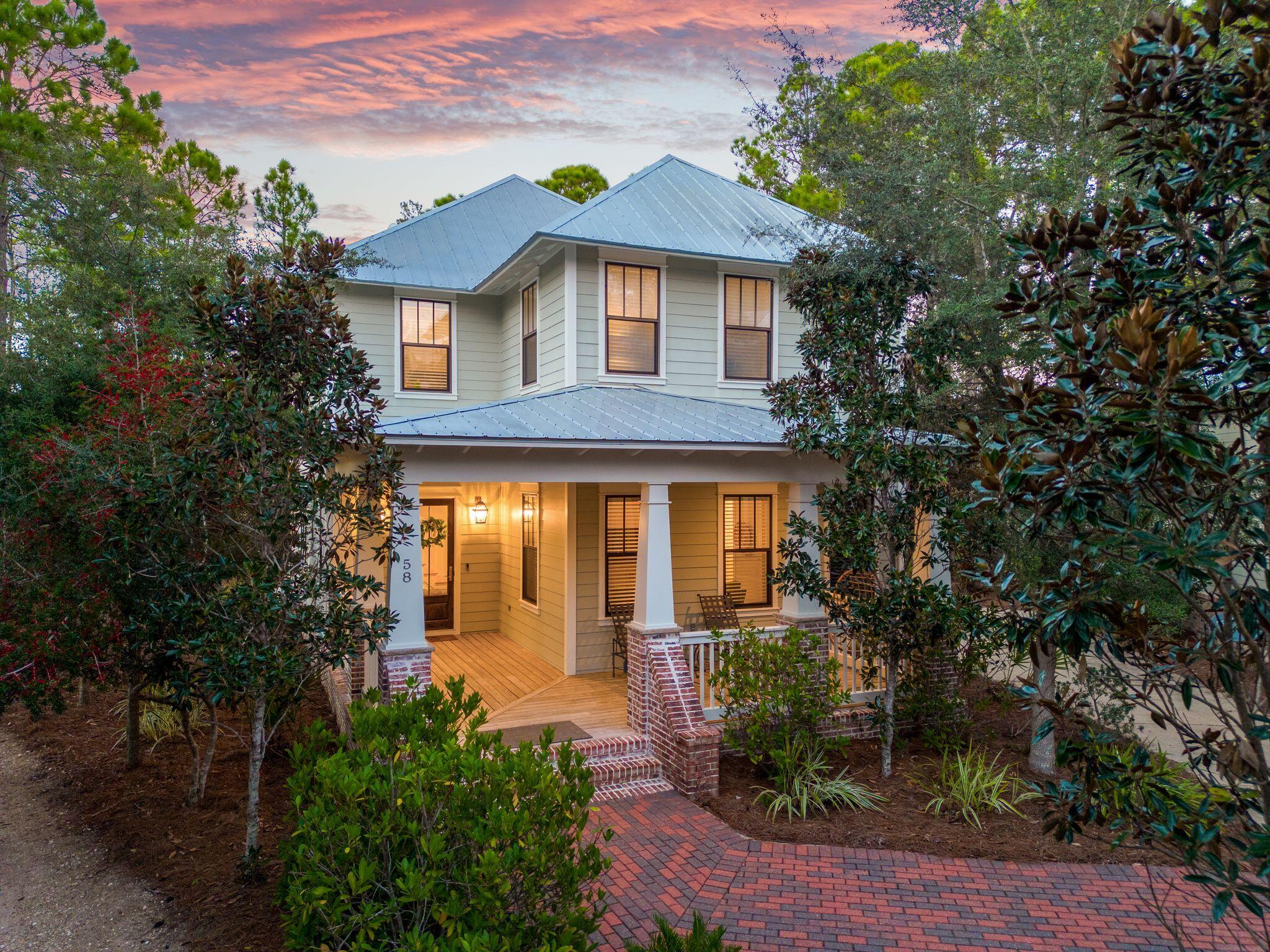 Embrace one of the most private, water-view locations in the coveted Forest Lakes community. 58 Okeechobee Circle offers the ability to live maximally and spread out both indoors and out. An expansive backyard wraparound deck looks out and leads to the community's lakeside nature trail, while many rooms indoors offer tranquil vistas of the lake and natural world around it. This amenity-rich retreat offers 4 bedrooms plus a sizeable bunk room, chef's kitchen and attached garage. The gated Blue Mountain Beach community provides a recently refurbished two-tiered pool with waterfalls, an architectural poolhouse with summer kitchen and fireplace, lakeside trails, playground, basketball hoop, all while backing to the State Forest for nature hikes and just moments from the public beach access.