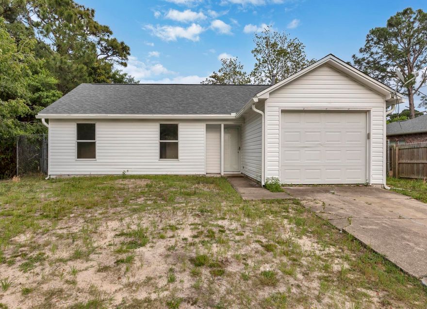 *** PET FRIENDLY! ***  ROOM TO PARK BOAT OR TRAILER!   GARAGE, FENCED BACKYARD, NEW DECK & UPDATES.   Just 3 Miles to Hurlburt Field and 6 miles to Navarre Beach; 9 miles to Downtown Fort Walton Beach & Okaloosa Island Beach.   Close by to Restaurants, Shopping, Beaches, and Recreation.  Recently updated with New Roof, New Siding,  All New Lights & Fans, New Stainless Steel Oven/Range, New Range Hood, New Toilets, and recent paint/carpet.  This home is at the end of Aleta Avenue, and thus offers much privacy.   Fenced backyard is ideal, along with room for a Trailer or Boat to be parked beside the house.   Full bath in hallway; half bathroom in the Master Bedroom.  Washer & Dryer hookups are conveniently located in the Garage.