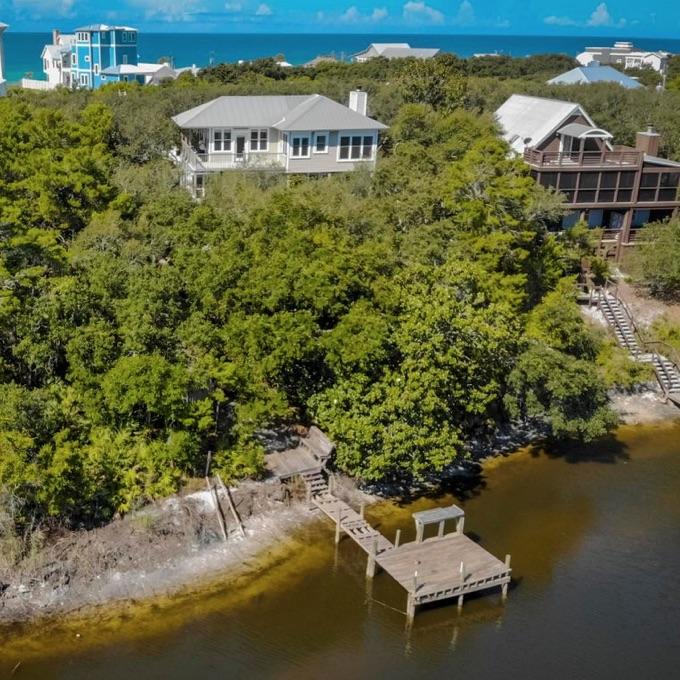 Unique beach cottage directly on Big Redfish Lake. The large lot and mature trees offer privacy in a serene setting. Walk to the beach or paddle board from your own private dock. 3 bedrooms, 3 1/2 baths, Saltillo tile flooring, wood burning fireplace in living room and numerous decks for outdoor living. Kitchen features new stainless appliances and white quartz countertops. Lease term of 6, 9 or 12 months will be considered.