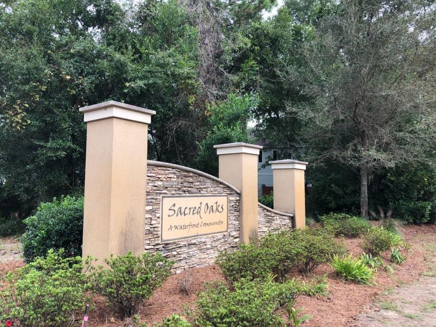 Build your dream home on this desirable water view corner lot in charming Sacred Oaks community. Located minutes from Sacred Heart Hospital, upscale Grand Boulevard shopping and dining. Close to the beautiful beaches with emerald green waters. Community fishing dock. Bay access for your water sports in addition to overflow parking for guests.