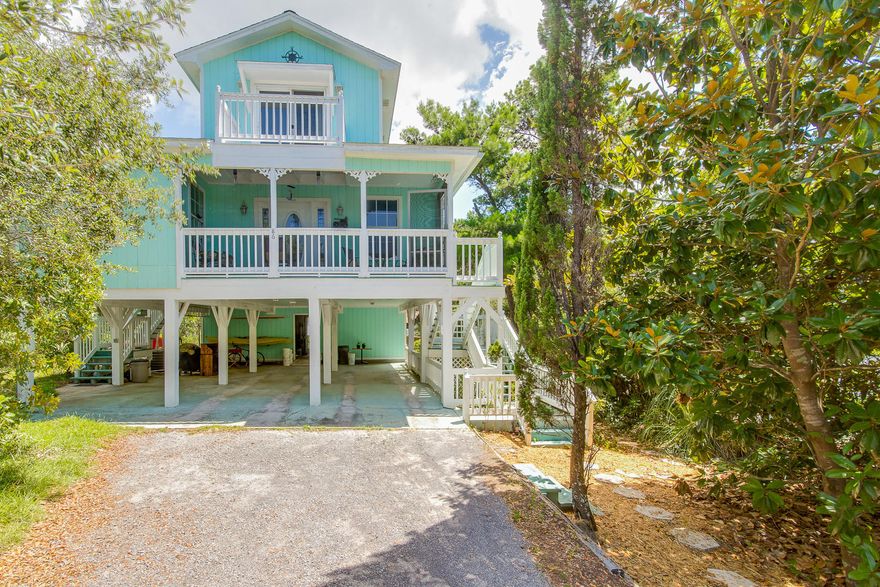 Nestled in wooded setting in the sought-after Beach Highlands neighborhood, this charming cottage offers a beach-like home with the unexpected bonus of abundant storage, vast living area, and unheard-of parking potential! Within walking distance to the pristine Stallworth Lake area, it features three bedrooms, two full baths, and a spacious master suite. Two generous porches (one screened) and parking for up to 6 vehicles underneath combine to make this home a winner as a beach getaway or permanent residence.