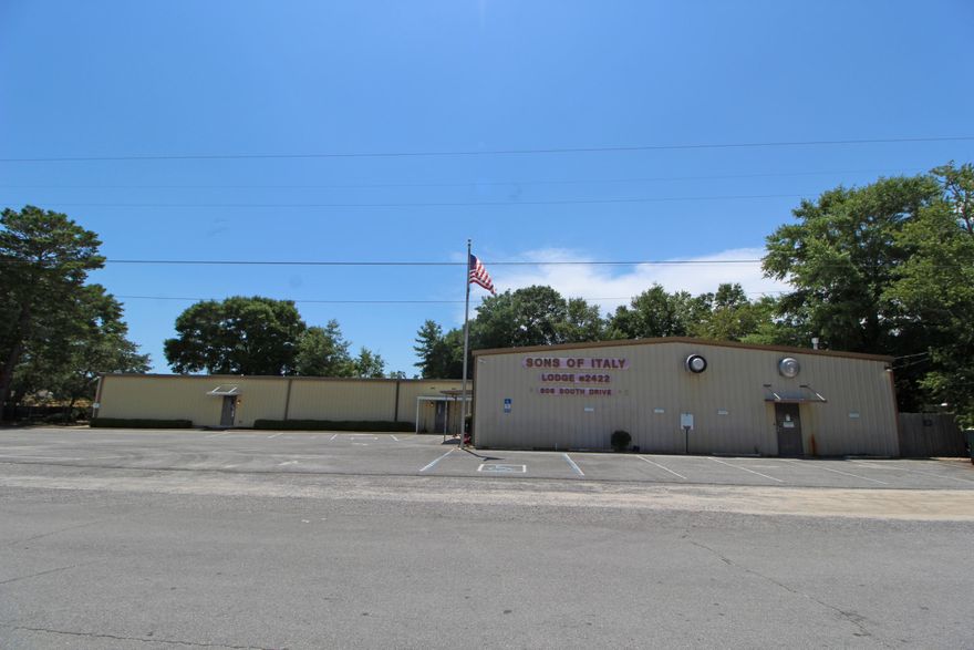 SONS OF ITALY LODGE IS A METAL BUILDING WITH 8,800 SQ.FT. HEATED AND COOLED, BUILT IN 1985. IT HAS A FULLY FUNCTIONAL COMMERCIAL KITCHEN, A BAR WITH A SMALL ADJOINING KITCHEN, TWO LARGE MEETING ROOMS, FOUR BATHROOMS (HANDICAP ACCESSIBLE), A LOADING DOCK AND STORAGE AREA. BUILT IN PA SOUND SYSTEM. THE ASPHALT PARKING AREA IS APPROXIMATELY 9,080 SF. THE ADJOINING FENCED VACANT LOT IS +/-.40 ACRES. THE ROOF WAS REDONE IN 2013 WITH A TEN YEAR WARRANTY ON WORKMANSHIP AND MATERIALS.