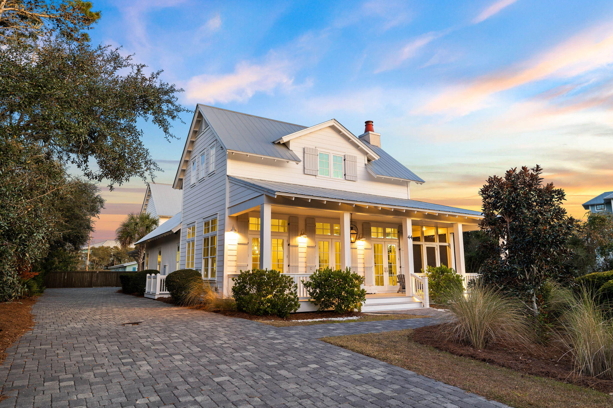 Nestled in the eastern end of 30A, 44 Seacrest Drive captures the essence of coastal living. Enjoying a sought-after location by the beach, this residence offers both convenience and tranquility. Step inside to discover a meticulously curated interior that seamlessly blends modern elegance with seaside charm. The dream kitchen showcases inset cabinetry along with Wolf & Sub-Zero appliances. Boasting beautiful quartz countertops, the large island is the perfect gathering space in the kitchen. The living room has been exquisitely designed with a gorgeous fireplace & opulent furnishings. The screened-in porch features comfortables spaces for outdoor dining & lounging. Overlooking the pool, the outdoor kitchen has been fully equipped with a gas grill, refrigerator & sink. The backyard is an absolute oasis with its 34x16 heated private pool, bubbling spa & artificial turf yard. The charming home features six bedrooms, each offering a tranquil retreat at the end of the day. The main house offers living spaces on the first and second levels. The carriage house has been superbly designed with a full kitchen, roomy living/dining areas & long porch overlooking the pool. As an added bonus, the property has a 2 car garage along with a 140ft driveway. The property has generated strong rental income yearly and comes with a rental projection of $286,895 for 2025. The property can easily accommodate up to 14 total guests. 44 Seacrest Drive has been diligently crafted to provide an unparalleled 30A experience. The net income projection for the property is $184,124 annually. Reach out to review the rental income history, rental income projection, estimated expenses & net income projection. Tour this property today before it's sold!