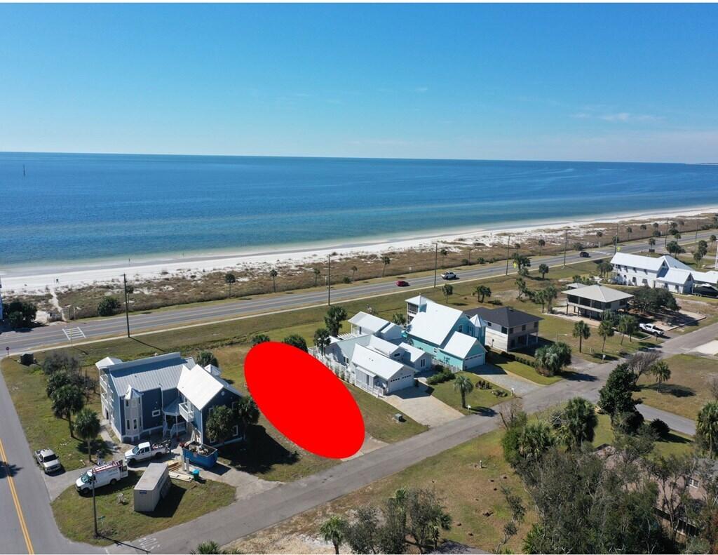 Fabulous X zone lot with westerly views of the Gulf of America. Enjoy year round sunsets from this large 75' x 167' lot that has beautiful palm trees and foliage throughout. Former homesite that has water and sewer taps in place as well as a concrete driveway and slab in place. Short distance to one of the two gated and locked private access points to the beach. Easy access via the rear of the property that is just off the main entry to Gulf Aire Subdivision. Low annual HOA fee of just $316.00, that allows access to pool/ common area and two private gated entrances on either end of the secluded and fenced gulf front HOA parcel. Gulf Aire is one of the few beach subdivisions that does not allow short term rental in order to minimize transient traffic. Dimensions obtained via Gulf County Property Appraiser's website, please verify if important.