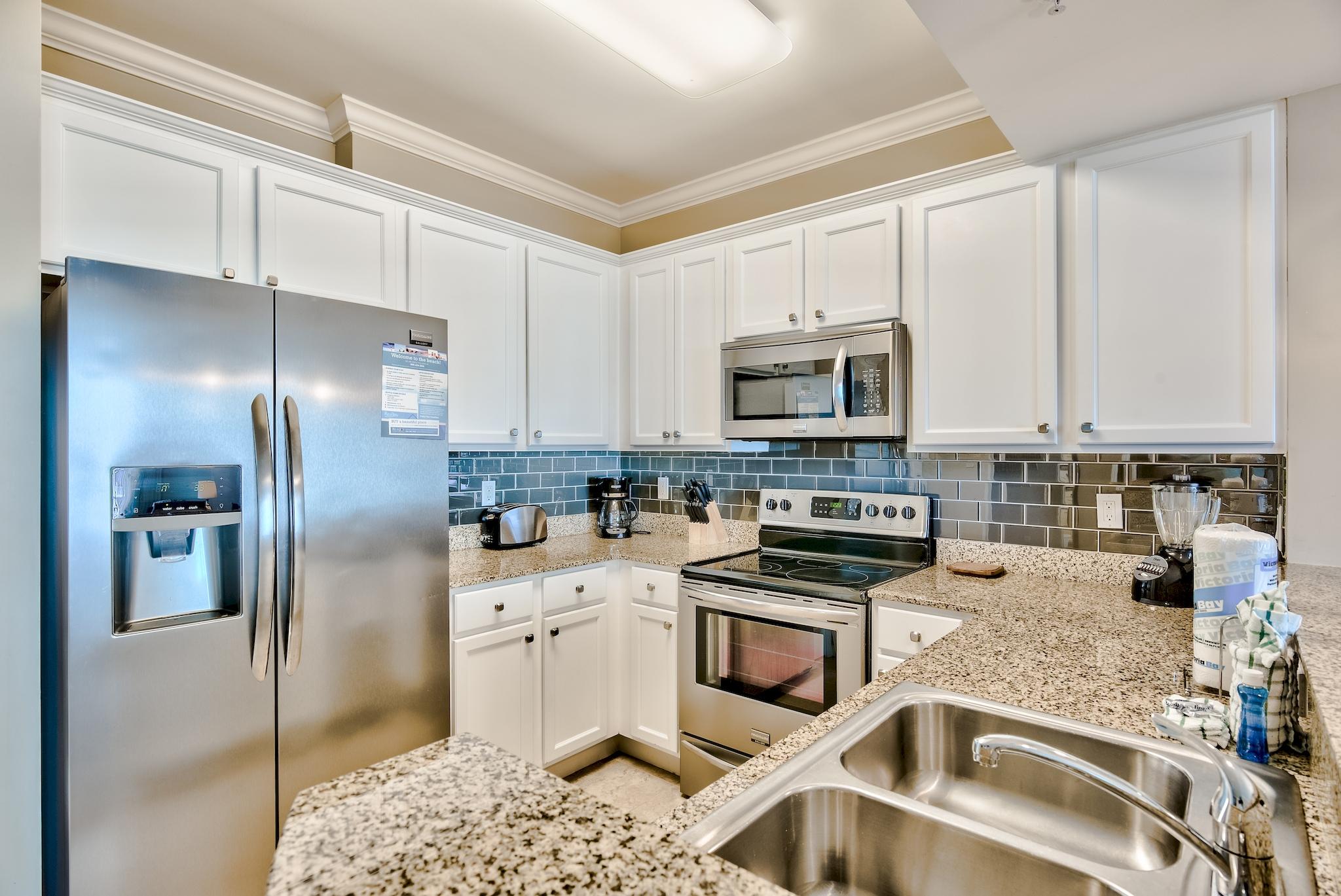 Check out this little slice of heaven in the heart of Destin! This 2 bedroom/2 bath unit overlooks the lush, tropical landscaping of the Palms and Destin Resort plus you have unobstructed views of Henderson State Park!! The kitchen has stainless appliances, white painted cabinets, subway backsplash,designer hardware and custom lighting over the breakfast bar! Master bedroom has it's own slider to the patio with a king size bed. Built in bunk beds with full bed on bottom and twin on top. With sleeper sofa in Living Room, unit sleeps 6 comfortably! This unit is turnkey ready!! Perfect as a primary residence, 2nd home or investment. There are a ton of updates-such as crown molding, beach artwork and crown molding in main living areas. Exterior features a private patio-just steps from the 11,000 sq ft lagoon pool, w/ waterfalls and bridges within the 2 acre ''oasis''. The children's pool and interactive splash fountain will provide hours of enjoyment while the parents enjoy a swim, or lounging with a drink from the on site restaurant and coffee shop. Seasonal shuttle service provided to local attractions such as Harborwalk and beaches! The Palms is located in the heart of Destin-only .03 miles to June White Decker Park with free parking and public beach access. HOA includes all utilities-even internet and electricity! Other on site amenities include-pickleball, basketball, covered parking and owners parking lot. Buyer to verify all information.
