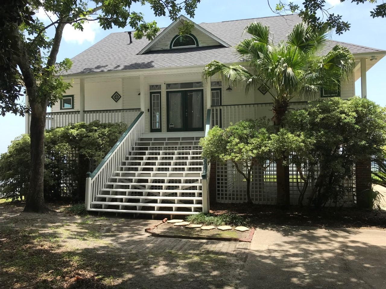 A piece of paradise with stunning views of the intracoastal waterway from almost every room in the house! This 3 Bedroom home sits high and dry out on a point offering privacy and seclusion yet minutes to shopping and our white sandy beaches and emerald waters.All new storm windows within the last 18 months (impact resistant and some are double hung), New roof in the last 6 months, Freshly painted inside, New aluminum fencing and gates. The Master bedroom and bath are on the main floor. Bath has whirlpool tub and separate shower . On the 2nd floor are 2 bedrooms with a connecting bath in between with separate vanities. Lots of windows with water views and a glass door that opens to a veranda with views of the Gulf of Mexico. In the upstairs bedroom there is storage behind each