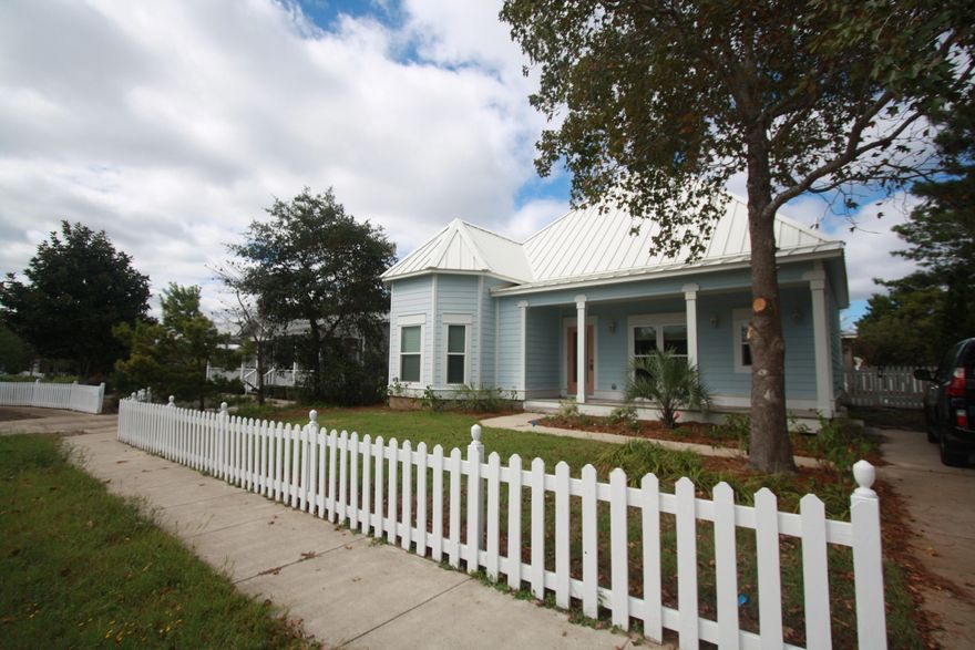 REDUCTION ON FORECLOSURE! A bright 3 bedroom, 2.5 bath property built in 2009. Charming white pickets throughout the neighborhood.Property has covered front porch, screened back porch,splash pool, 2 gas fire-places, galley-style kitchen with GE Profile appliances,Rinnai hot water and good storage. Short distance to the community pool and public beach access. View this property to appreciate the open floor plan, Kohler fixtures, designer-style lighting, vessel sinks. Primary residence, second home, or vacation-rental for investment--this property fits the bill. Flooring in bedrooms and living area are laminate, baths are 18'' diagonal tile. Granite in kitchen and baths. Vessel sinks continue the contemporary flair. (Buyer to confirm all information, fees, and measurements.)