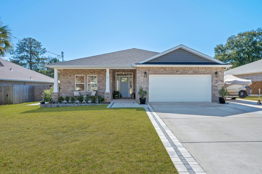 Boat Lovers, Take Note! Don't miss your opportunity to own this stunning 2023 home nestled in the highly sought-after Poquito Bayou neighborhood, just minutes from the community boat launch. Designed with outdoor enthusiasts in mind, this property features an oversized driveway perfectly suited for boat and jet ski parking--making waterfront adventures effortless.Offering 2,520 square feet of thoughtfully designed living space, this home showcases elegant finishes and fixtures throughout. The open-concept living, dining, and kitchen area creates the perfect backdrop for entertaining, anchored by an oversized kitchen island, soft-close cabinetry, stone countertops, and stainless steel appliances. Seamlessly transition outdoors to a custom paver patio, resort-style pool with built-in sundeck, and an incredible stand-alone outdoor kitchen complete with stainless steel gas appliancesideal for hosting unforgettable summer gatherings. Extra thoughtful additions such as the outdoor shower, raised garden pets and pet tortoise garden run, truly make this home special. There is even room to park a small boat inside the backyard gate. 
Enjoy endless evenings lounging poolside, dining al fresco with friends and family, or cultivating your green thumb with built-in garden beds along the side of the homeall while preserving ample green space for backyard games and festivities.
Inside, the home feels open and airy with 5 bedrooms, 3 bathrooms, and a dedicated office located off the primary suite. The split floor plan offers privacy, with an exclusive primary wing accented by oversized barn doors. Retreat to your private sanctuary featuring a spa-like ensuite with a soaking garden tub, glass-enclosed shower, private water closet, dual vanities, and a spacious custom walk-in closet with built-in cabinetry and shelving.
Built in 2023 and thoughtfully improved since, all major systems and appliances are new or newerproviding peace of mind for years to come. Additional features include tile throughout main living areas and bathrooms, carpeted bedrooms, and high-end finishes throughout.
Ideally located within walking distance to the neighborhood boat launch and playground, just a short drive to the white sandy beaches of Okaloosa Island, minutes from Eglin AFB, and only 15-20 minutes to Hurlburt Fieldthis home truly offers the perfect balance of work, play, and coastal living.
Welcome home to your own slice of Florida paradise.
