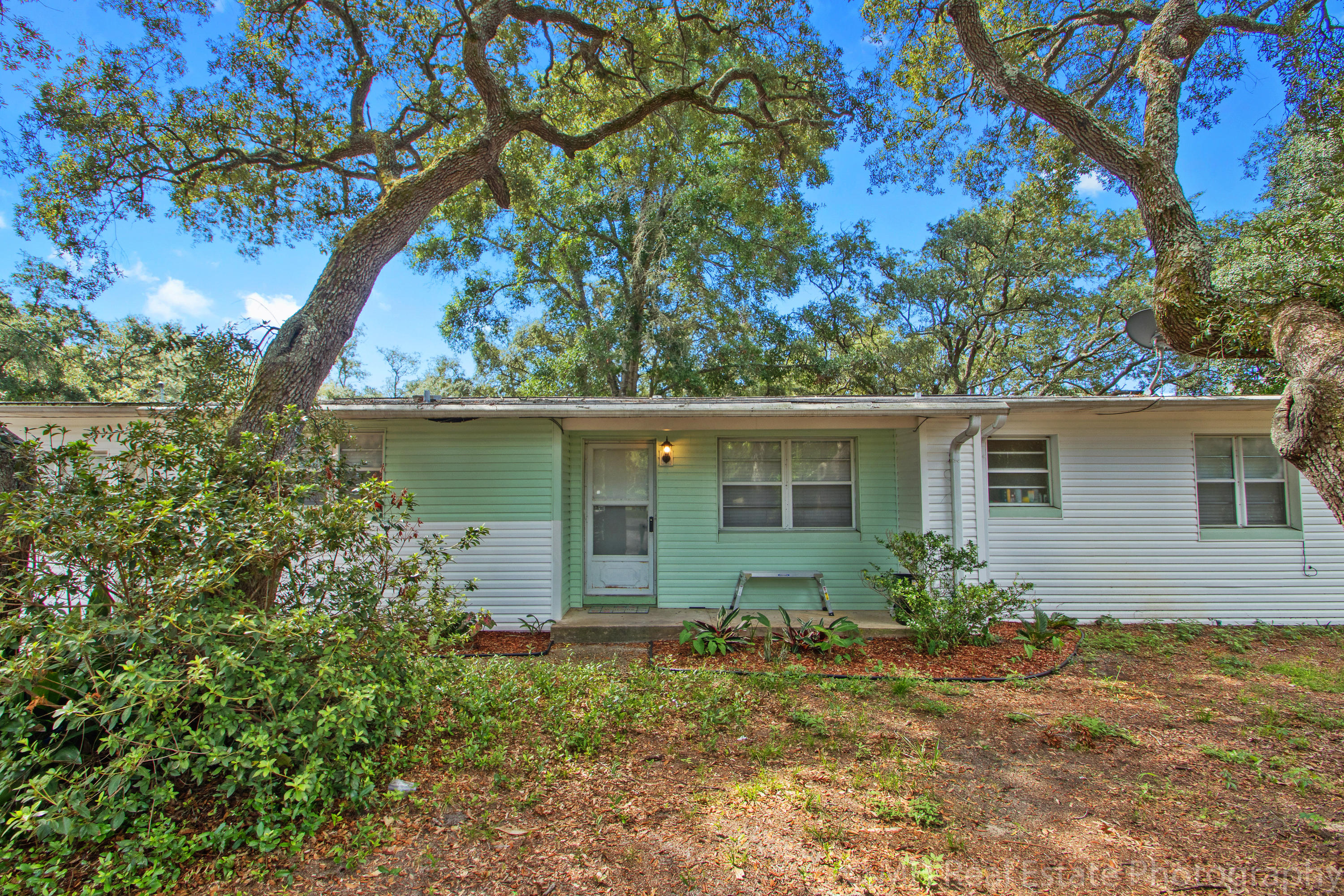 TWO FOR ONE PRICE! This is a lovely remodeled mid-century home with a separate one bedroom apartment in the back. This is perfect for a mother-in-law suite or could potentially be used for additional income (buyer to verify zoning). The main house features two living areas, a beautiful kitchen that has been upgraded with granite countertops and new appliances, a dining room, three bedrooms and one full bath. The Apartment features a living room, dining area, full kitchen, full bath, washer and dryer hookups and a generous sized bedroom. And the entire apartment is handicap accessible! There is a large deck and very spacious yard and there is a window ac cooled pre-fab workshop in the rear of the property as well. Great investment opportunity. Call to schedule viewing today!