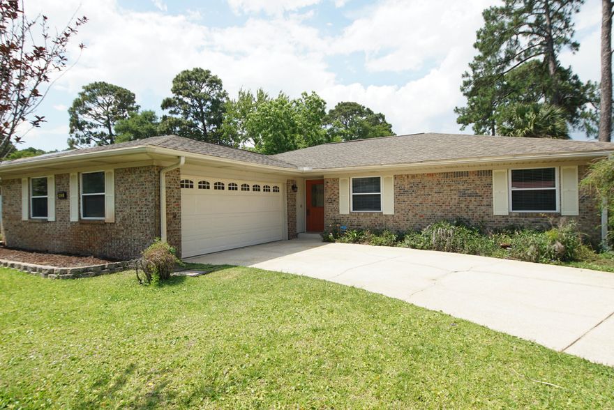 Updated 4/2 single story brick home on a corner lot located in the Tanglewood neighborhood Fort Walton Beach. Updates include a completely remodeled kitchen including designer cabinets, granite countertops, tile back splash, stainless appliance's and wood look porcelain tile flooring throughout. Bathrooms upgraded as well including a master walk-in shower with custom glass door.  Florida room off the living room.
***New roof to be installed prior to 
closing!!!
All appliances including washer and dryer stay! 
This home is only 6 min drive from Hurlburt Field, 10 Min to Eglin AFB.
