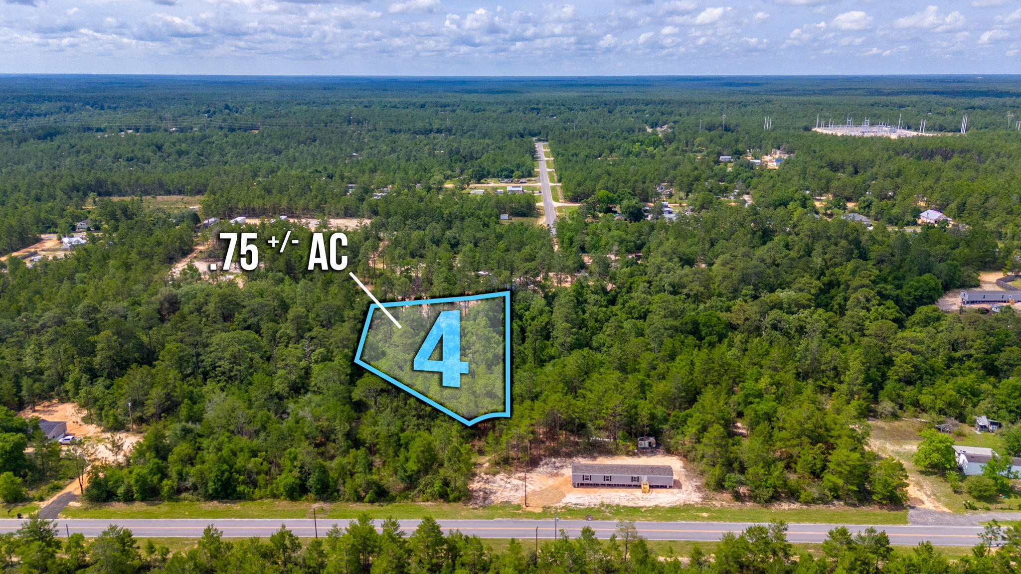 Unleash your dream home's potential on this large lot in Oakwood Hills Unit III. No restrictions mean limitless possibilities against a wooded backdrop. Manufactured homes are allowed. Lot is located in flood zone x & no wetlands according to the county GIS map. Power & public water are available along Woodlands Blvd. A private septic tank would be needed. Located approximately 150 ft off of a paved county road. Size of lot is estimated off of the plat map & would need to be confirmed by a survey.