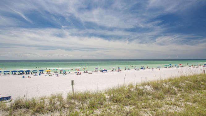 Beautiful penthouse on Miramar Beach with spectacular views of The Gulf of Mexico from your living/kitchen area, master bedroom and oversized balcony. Enjoy unbelievable sunrises and sunsets and watch the dolphins play from your own deck! Travertine floors, granite countertops, stainless appliances and upgraded cabinets are just a few of the many extras. Master bathroom has separate shower and jacuzzi tub. Three bedrooms plus a bunk room make this an ideal rental or family retreat. Enjoy your own deeded parking space under the building. Seascape resort has 18 hole golf course, Gulf view fitness room, gated community, heated indoor pool, an outdoor pool and 2 hot tubs. One of the most beautiful beaches in the area is just steps away. There are many restaurants and shops nearby. Home is