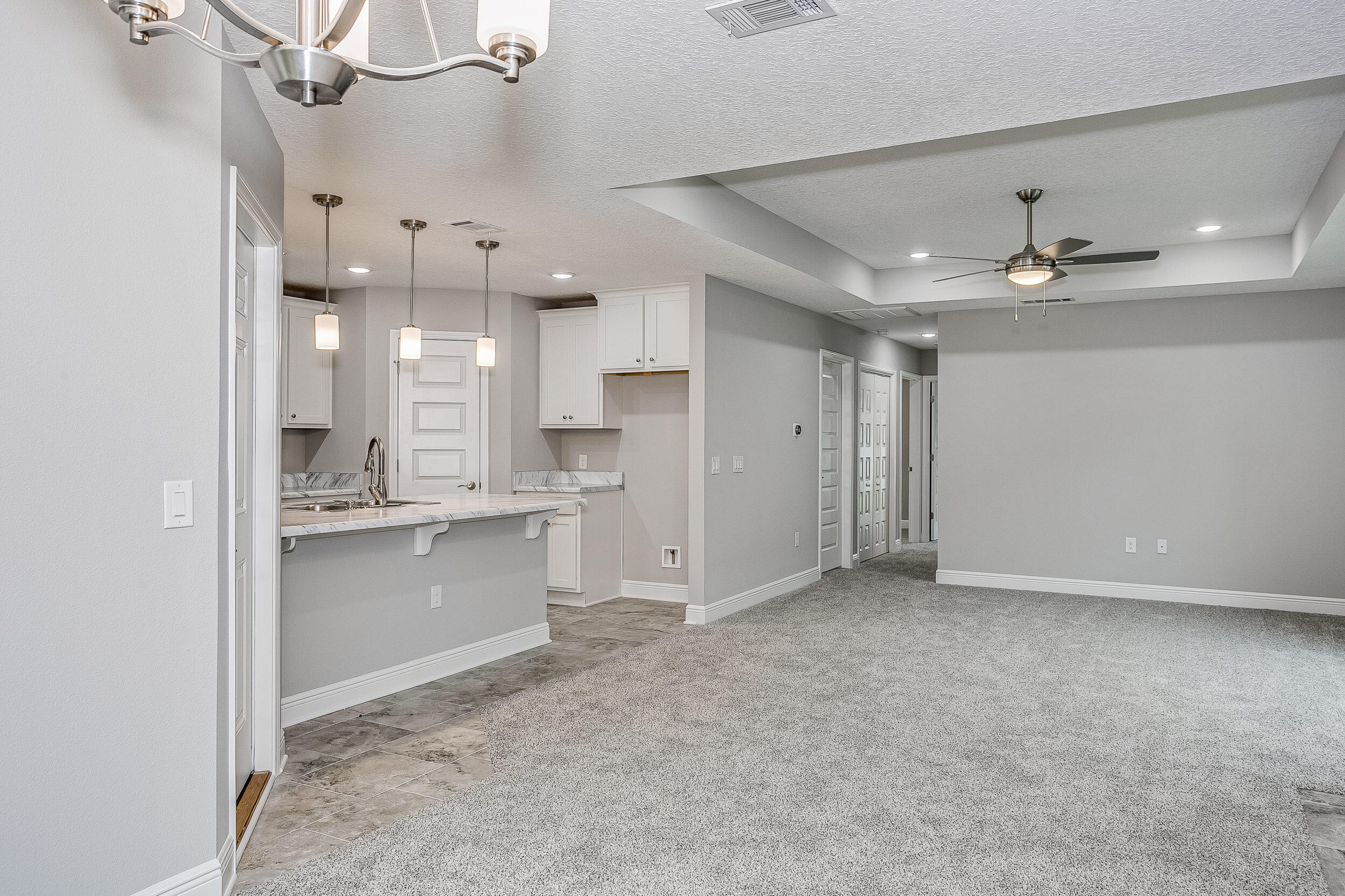 The Tarragona Floor Plan features an open living/kitchen/dining area with granite counter tops, shaker style cabinet doors, walk in pantry, appliance package featuring stainless steel range, dishwasher, microwave and breakfast bar. The master suite features a large walk in closet and master bath includes fiberglass tub/shower combo, single vanity with granite countertops. The guest bath includes granite counter tops and tub/shower combo and tile flooring. The single car garage is painted and trimmed with 2 garage door openers, insulated garage door. This home also includes programmable thermostat, security system, and Taexx pest control system. PHOTOS NOT ACTUAL HOME. COLORS/SELECTIONS VARY