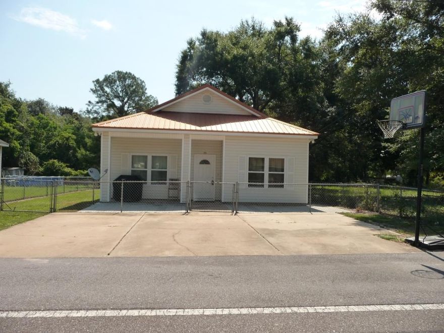 3 bedroom, 2 bath home located in Niceville - just minutes from Eglin Air Force Base, shopping and access to the Mid-Bay bridge. This home has several upgrades for higher efficiency. In 2011 the seller installed a new metal roof, a new heating and air conditioning unit, a new front door. All windows are dual pane, double hung and hurricane impact resistant with lifetime transferable warranty including the screens. The entire home has been updated with laminate wood flooring, trim and new fans/lighting. The kitchen has tile flooring and nice white cabinets. The stove was replaced in 2014, the refrigerator was replaced in March 2015 and the built-in microwave was replaced in Aug. 2015. The exterior features include a very large (50x150) fenced in yard, a storage shed and carport.