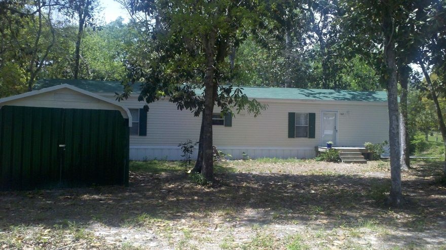 Looking for a turn-key, ready-to-move-in, bring-your-toothbrush!, kind of weekend-end get-a-way? This is it!!
Uniquely situated on two lots on a canal that leads to Black Creek and has view of adjoining lake. Peaceful setting with large screen porch overlooking the water. Home is like brand new. Detached metal workshop and carport for storage of the boat and fishing gear. Give it a look & be ready to relax in your new home away from home!