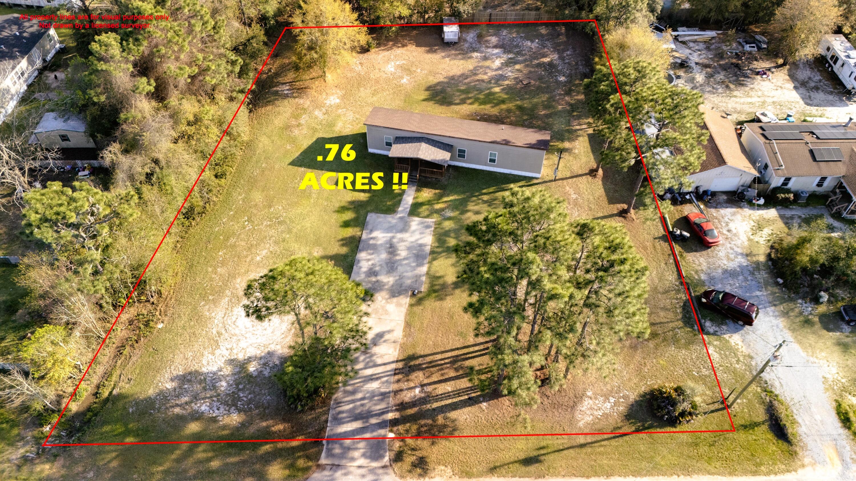 Rare Opportunity to subdivide or develop yourself! Expansive .76-Acre Lot with Mobile Home! Located just minutes from Navarre's pristine beaches, this unique property offers endless possibilities as it's perfectly positioned to capture the essence of coastal living. The .76-acre lot, shaded by mature trees, can be enjoyed as-is or subdivided into multiple parcels for the savvy home builder or investor. An existing mobile home provides a cost-effective way to settle in now while building equity in this prime location. Whether you're seeking a spacious personal retreat, a site to develop multiple homes, an affordable path to homeownership, or a turnkey rental investment, this property delivers. No HOA property has a new survey completed along with an inspection report detailing the impeccable condition of the 1090 gal. Septic tank permitted for up to 4 bedrooms currently or 1800sf structure. Septic tank was pumped and filter cleaned March 27th, 2025. Power pole has an external RV plug and all utilities are currently active. Please contact the property owner directly for any and all inquiries at Gulf Life Properties 850 396 1818