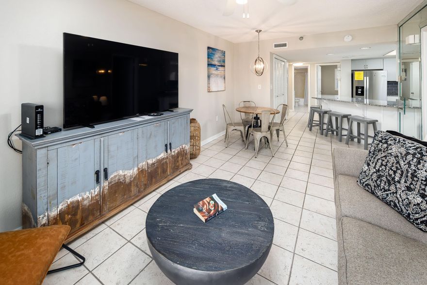 Savor Gulf views from this fully furnished 2 BR/2 BA unit in the Nautilus Condominium! Tile flooring throughout. The kitchen has ample cabinet space and was UPGRADED in 2022 with a granite countertop, new stainless-steel appliances/sink, modern faucet, and tile backsplash! The breakfast bar offers extra seating. The unit includes a combo washer/dryer. All NEW sliding glass windows/doors were installed in the last 2 years. This end unit has a long wrap-around balcony with owner's closet. The primary bedroom has a Gulf view and direct balcony access. The primary bathroom has a double vanity. A new HVAC system was installed in 2022 too! Nautilus amenities include beach access, pool, BBQ grill area, and complimentary parking. Rental revenue projection is $60K/year. Listing agent is the seller.