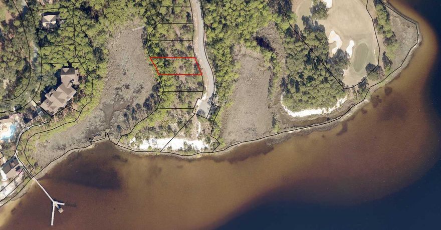 Perfect site for your dream home! This .25 acre lot is very close to beautiful Lake Powell as well as the many amenities of this master planned retreat. Wild Heron is gated and includes 734-acres in this Coastal community!  Lake Powell has the distinction of being Florida's largest Coastal Dune Lake!  Amenities include a fitness center, heated pool and hot tub, a boat house for storing kayaks and paddle boards, community dock, fire-pit and gathering area with fireplace, all overlooking Lake Powell. 24 miles of trails & bike paths are also available for the outdoor explorers.Golf club and beach club memberships are available to purchase. Greg Norman's Sharks Tooth golf course is award winning. In addition there is a club house and hydro court tennis courts!