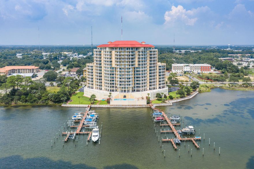 UNDER CONTRACT- 72 hour kick out clause in place. Good living with Gulf views! Welcome to PYC. Waterfront condos with beautiful sunsets over the Gulf. Surrounded by elegance, ambiance & all the joys waterfront living has to offer. Peaceful hallways and friendly owners provide you with privacy & security. Take in the incredible views from your spacious balcony and pool area. All the upgrades you are looking for; New black stainless appliances, granite countertops, tiled floors throughout hallways, kitchen and bathrooms with floating wood floors in bedrooms. Raised cabinets, high recessed ceilings, crown molding, jetted garden tub, and so much more. Amenities include parking garage, pool & hot tub, theater room for screening parties, gym, and guest quarters for extra space.