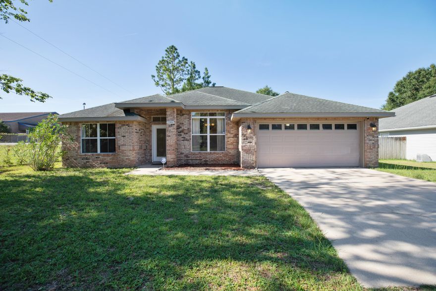 Welcome Home! This custom-built brick home in Trailwood Estates is perfectly located in the heart of Crestview - close to shopping & schools. As you enter the home, the formal dining room is located to the right with a view to the kitchen. The spacious kitchen has granite counters, beautiful custom maple cabinets, upgraded stainless steel appliances plus a breakfast bar area. The family/living area is spacious and features a gas fireplace. This split-bedroom floorplan offers four bedrooms and two bathrooms. Three of the bedrooms are located on the left side of the home. The master bedroom is located on the right side of the home and has a trayed ceiling,  garden tub, double vanity and two walk-in closets. This home has a tankless hot water heater so you never have to