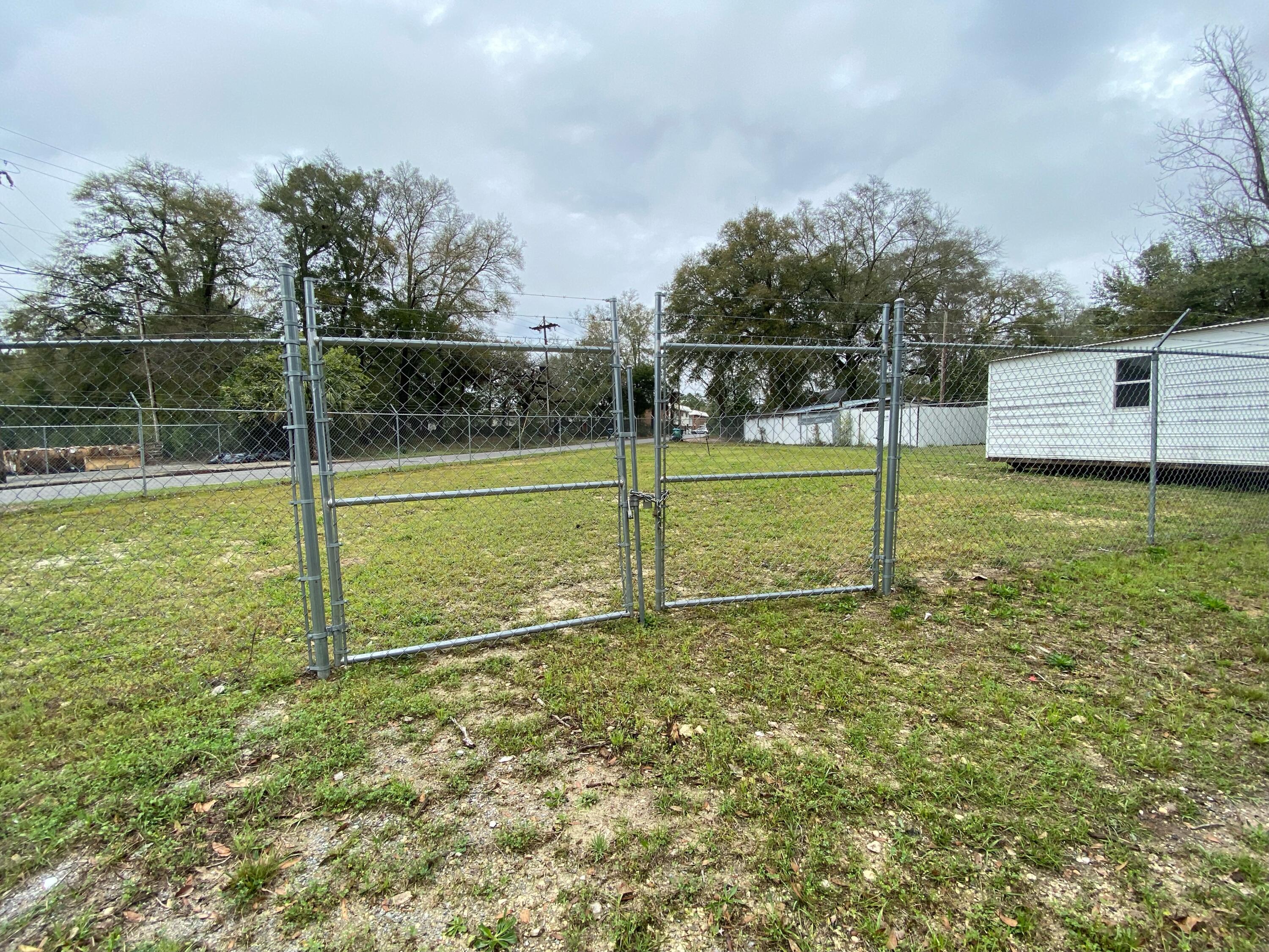 Don't miss out on this great opportunity!! This Vacant lot is in the heart of town. Bring your build plans and build your new home here! High fence runs around the perimeter of the property and a storage shed on the property. City Zoned as Mixed-Use and is in walking distance of a local grocery store and is just shy of Hwy 90.