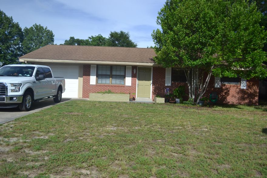 Perfect location close to beaches, restaurants, shopping, and bases! Wonderful family home situated on a large lot in the heart of Ft. Walton Beach. Step into an open floor plan with vinyl plank flooring and tile in kitchen. Kitchen cabinets have been freshly painted with tile counters and back splash. Huge master bedroom with large walk in closet. Kitchen and dining lead out to the new wood deck that perfect for grilling out. Master bathroom has been renovated with double vanity and tiled shower.  Adjoining bedroom next to master could be nursery, sitting room, or office. Two more bedrooms and a full bath complete the perfect package.