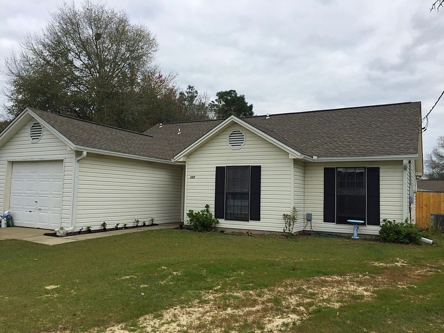 HUGE Backyard! Don't miss this great starter home South of I-10. There is new laminate floor in living room and halls. New carpet in bedrooms. Tiled kitchen with new dishwasher and microwave. New 80 gal water heater installed Jan 2016, roof 2014, A/C 2011. Home was recently converted to city sewer as well. Did I mention a huge backyard?