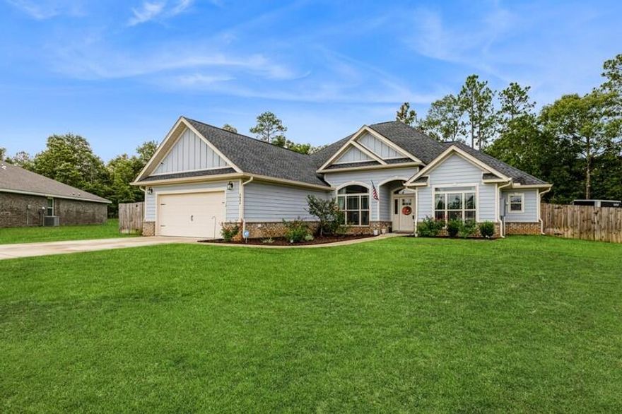 Welcome home to beautiful Heritage Plantation!  Wonderful 4 bedroom and 2 1/2 bath built by Halifax Homes (NOT a DR Horton Home) and just shy of 3 years old.  Well maintained and on a cul de sac so that you don't have to worry about pass through traffic.  Entering through the foyer, you are greeted by clean, neutral colors from the wood laminate floors which are featured throughout the common areas.  Open and split floor plan is perfect for today's family with the expansive kitchen completely open to the roomy living area so that no one is left out.  Kitchen features stainless steel appliances, granite counter tops and loads of cabinets and counter top space with a cozy breakfast area that overlooks the large privacy fenced back yard.  Behind the kitchen you will find